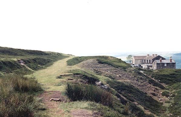 Rosedale West in 1990. Standing with back to the end of the line looking towards Blakey Junction. Remains of terrace of railway cottages by the loco shed below to the right (Roy Lambeth)