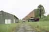 Four storehouse (right) and WW2 huts (left) seen from Harmans Way (Nick Catford)