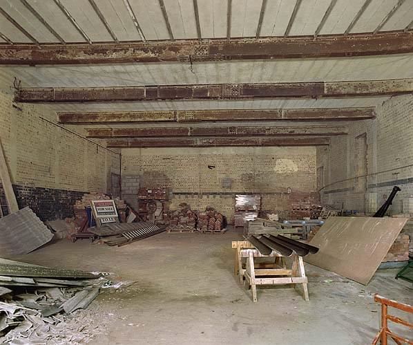 The reporting hall at Patrington, now stripped of all fittings. The line of the upper floor level can clearly be seen as can the now blocked link passage into the rooms to the right. The sunken well was at ground level in the foreground (Nick Catford)