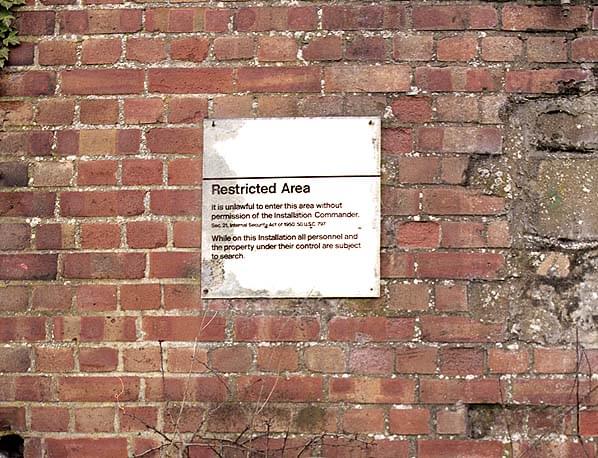 Old sign on the eastern charging building - there are several similar signs around the depot (Nick Catford)