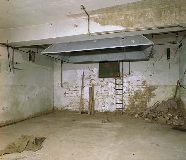 Transmitter room in the buried reserve; the extractor hood was over the transmitter. Note the emergency escape tunnel in the rear wall (Nick Catford)
