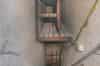 Looking down the west stairs with railed 'incline'. The storage area above the stairs was for spare gas filters (Nick Catford)