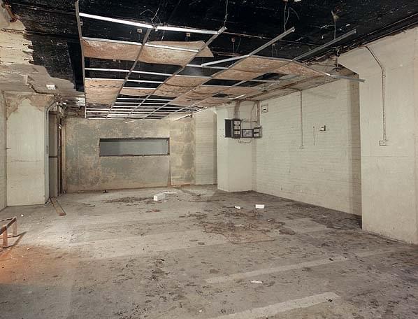 The frame room. The Main Distribution Frame (MDF) stands at one end behind the camera. The slot in the end wall was cut at a later date when the room beyond probably contained a recording studio (this was originally the switchboard room). There would have been a glass window between the two rooms (Nick Catford)