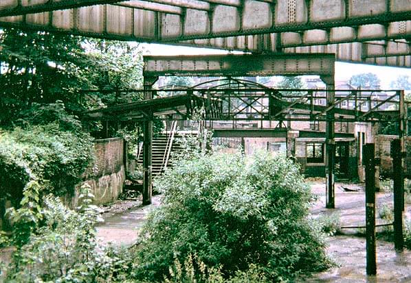 Platforms 1 and 2 with footbridge in July 1965. The iron girders for the arcaded walkway were still in place at this time (Ted Burgess)