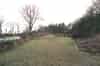 The parade ground - casemates on the left and buried water tank on the right (Nick Catford)