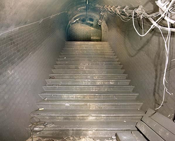 Stairs to lower lift landing. This side of the lift landing was not used during WW2 and was retained for ventilation of the Piccadilly Line (Nick Catford)