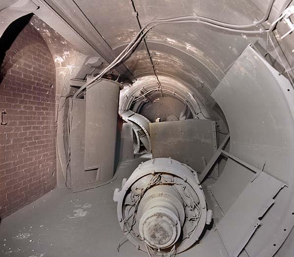 The lower lift landing. This side of the lift landing was retained for ventilation during WW2. A fan was once mounted in on the landing or in the lift shaft. This had no been dismantled with the parts lying in the subway (Nick Catford)