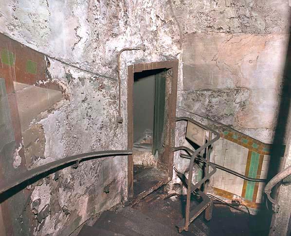 Door into GOR 2 form spiral staircase. Note some of the original tiling survives on the emergency stairs (Nick Catford)