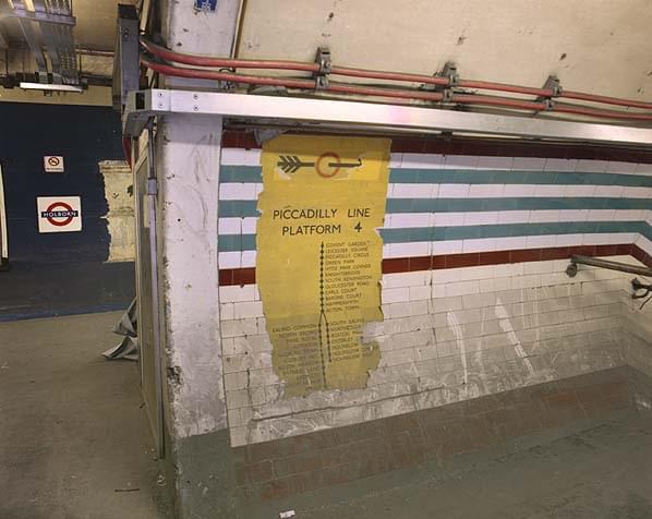 Top of the stairs down to the southbound Piccadilly line. The sign is confusing as it is showing the southbound Piccadilly line as Platform 4 when it should say Platform 3 (Nick Catford)