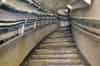 At the bottom of the spiral stairs a concrete stairway leads down to platform level. The original C & SLR tiling remains in place on the side walls and curved ceiling (Nick Catford)