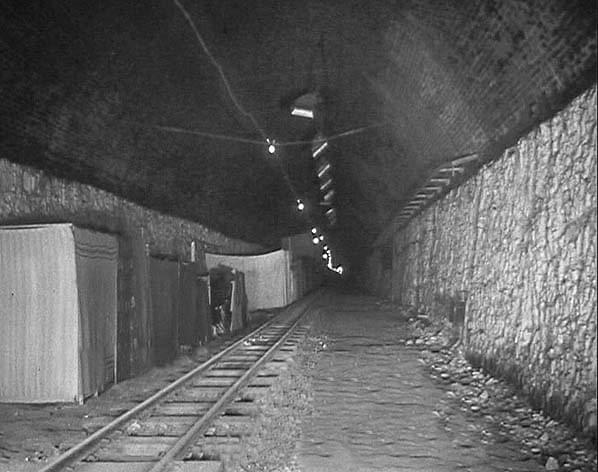 The railway tunnel in 1940 when it was in use as an air raid shelter. Lighting has been installed in the roof of the tunnel 