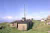 The R11 technical block. The WW2 CHL technical block can be seen to the rear with the Type 14 radar plinth to its right. The building on the far right now houses BT microwave equipment. The same building is exclusive to R11 Rotor stations. At RAF Snaefell it was used as a standby set-house (Nick Catford)