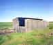 The standby set-house close to Kilchiaran Farm house with the base for the fuel tanks alongside (Nick Catford)
