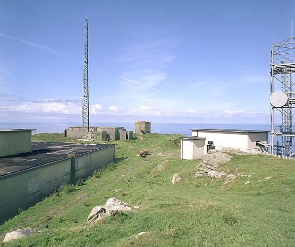 R11 technical block (left) with the WW2 CHL technical block behind with the Type 14 radar plinth behind that. The building to the right is probably post rotor and houses BT microwave equipment (Nick Catford)