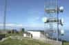 This building now houses BT microwave equipment. The same building is to be seen at other R11 rotor stations. At Snaefell it is the standby set-house although at Kilchiaran the standby set-house is in the village. The WW2 CHL technical block and Type 14 radar plinth can bee seen in the background (Martin Briscoe)