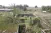 The WW2 command post. The open area for the height finder is in the centre. In the foreground is the stairway down to the semi-sunken rooms (now partially flooded). The east magazine can be seen to the left with the generator building in the background (Nick Catford)
