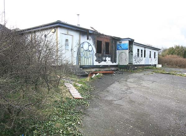 RAF Hartland Point domestic site in February 2007 - the station headquarters just inside the entrance to the camp is now wrecked and fire damaged (Nick Catford)
