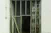 Remarkably unremarkable main entrance. There is a bellpush on the left of the grille (Richard Lamont)