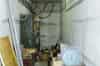 Store room at one end of the bunker, underneath the main entrance. The fat cables carry the 11,000 volt mains supply (Richard Lamont)