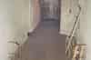 View from the bottom of the emergency exit stairs. The mains transformer is in the cage straight ahead. The sewage ejectors are through the doorway on the left (Sub Brit Collection)
