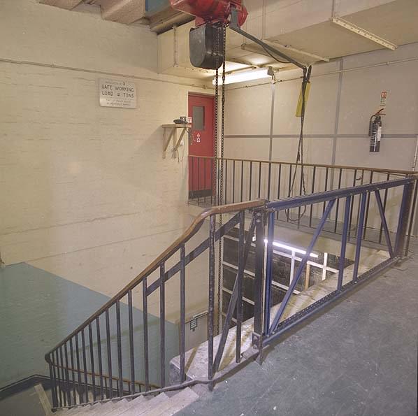 The main stairwell and plant hoist. The red door leads to the PBX and main distribution frame (MDF) Note the removable railings for machinery access (Nick Catford)