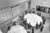 The floor of an R3 operation room in 1954 showing plotting tables and mission totes with an intercept cabin behind the window (this example is RAF Bawdsey)