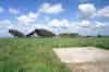 The four parabolic dish antennas lying on the ground in 1998. The chain home receiver block can be seen on the right and in the foreground the base for one of the Ace High building (Nick Catford)