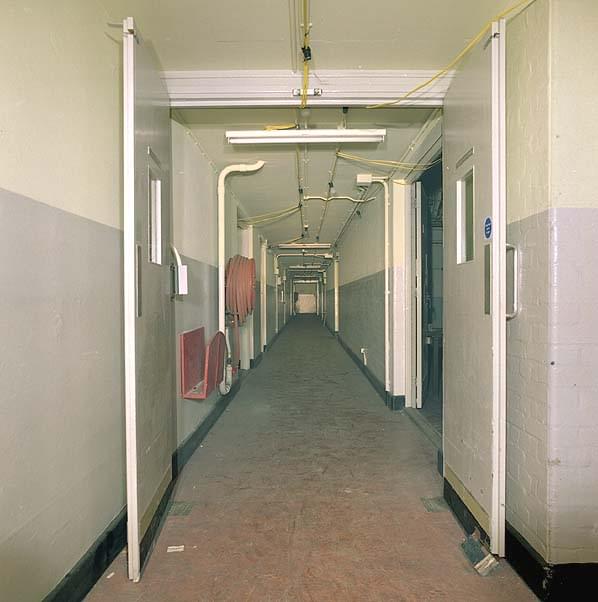 Looking north along the lower spine corridor. The BT equipment room is the double doors on the right (Nick Catford)