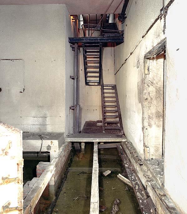 Emergency exit stairs. Air/Gas Filters (left), sump room (right) (Nick Catford)