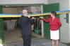 Sören Häggroth, the director general of Swedish National Fortifications and local authority commissioner Benita Wikström jointly cut the ribbon at the end of the handing over ceremony 