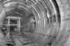 Construction of extension in 1952. 16' 6" diameter tube. Junction of steel and concrete rings in right foreground. Opening on right leads to 25' diameter tube. Timber struts for second opening in background. Start of pit to 7' ventilation tunnel in foreground (BT Archives)
