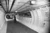 WW2 morale boosting posters still in place in one of the main access tunnels from the lift landing in December 1950. Shortly before refurbishment of the shelter to accommodate visitors to the Festival of Britain 