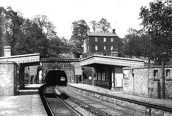 A longer shot of the same view, again in 1954, shows the extent of the tunnel. Despite the impression of a curve given by the approach tracks, the tunnel is totally straight 