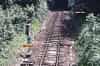 The view towards Grove Junction and Tunbridge Wells a few days before the end, in July 1985. Note the severe speed restrictions - as shown on the blue warning boards - and the poor condition of the trackbed, with very little ballast showing through all the mud. This line has been, quite literally, driven into the ground 