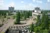 Pripyat central square seen from the roof of the Polissya Hotel. The Culture Palace is on the right and the two 16 storey apartment blocks are seen in the background (Nick Catford)
