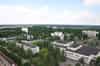Pripyat - view from the roof of one of the the 16 storey apartment blocks. The central square is on the right with the Polissya Hotel far right and the Cultural Palace to its left (Nick Catford)