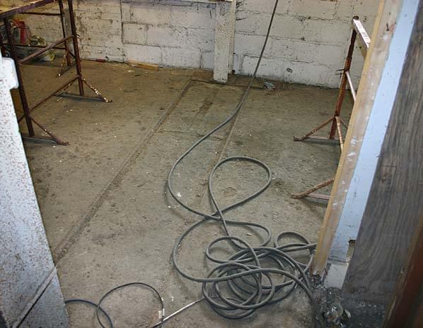 Guilford Colliery - narrow gauge rails still embedded in the floor in the workshop in May 2005 (Nick Catford)