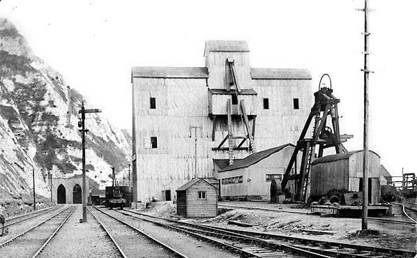 The abandoned Brady shaft is seen in the background; this remains much the same as in pictures above. The shaft was abandoned in 1897 due to running sand. The Simpson shaft head has been completely rebuilt and is surrounded by a large wooden building in this view from c1903 