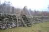 Wooden steps over the wall beside A713 for access to the post (John Anderson)
