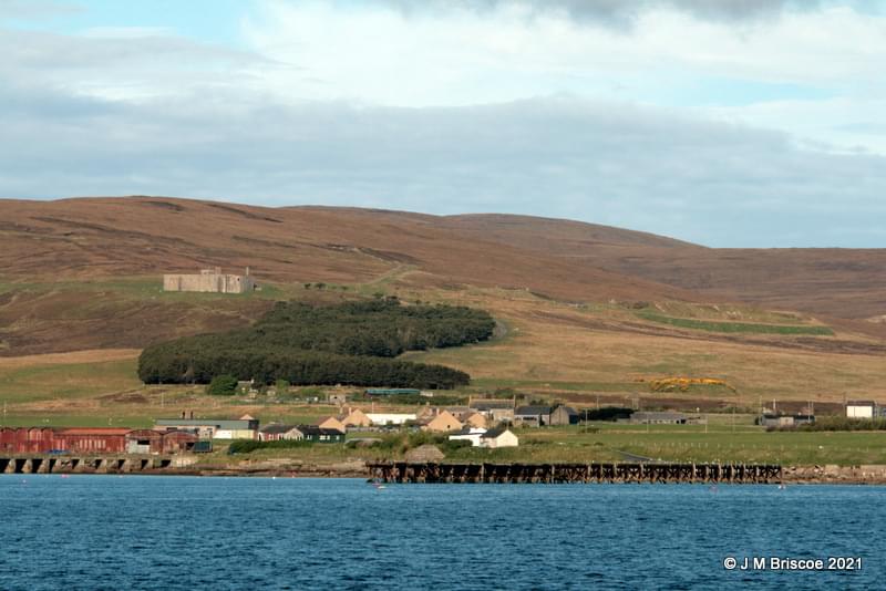Surface features of underground fuel tanks right of the building. (Martin Briscoe)