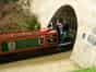 A hire boat emerging from the listed south portal of Blisworth Tunnel  in 2007 (Creative Commons: Cj1340 )