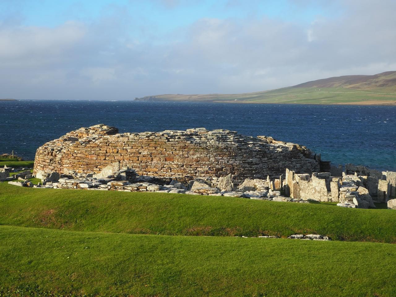 Looking north to Broch, with surrounding village buildings in foreground (Neil Iosson)