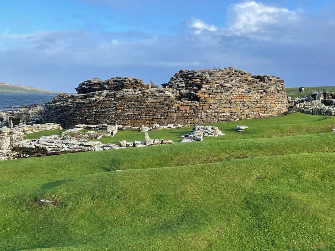View of broch and surrounding village buildings from west (Neil Iosson)