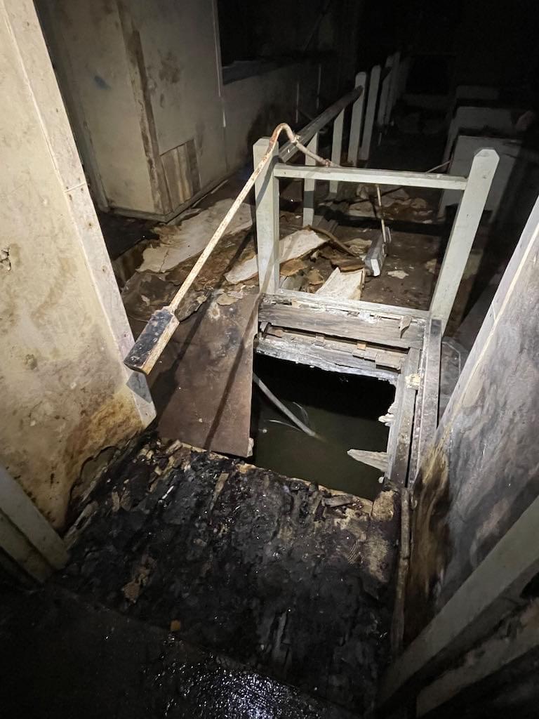 Floor of the gallery has given way in many places with water in the lower level clearly visible. (Neil Iosson - 2021)