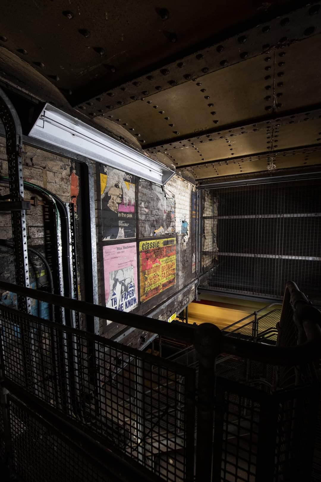 Old posters in the stairwell (Callum Cromwell)