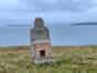 A lonely fireplace looks out over the sea (Neil Iosson - 2021)