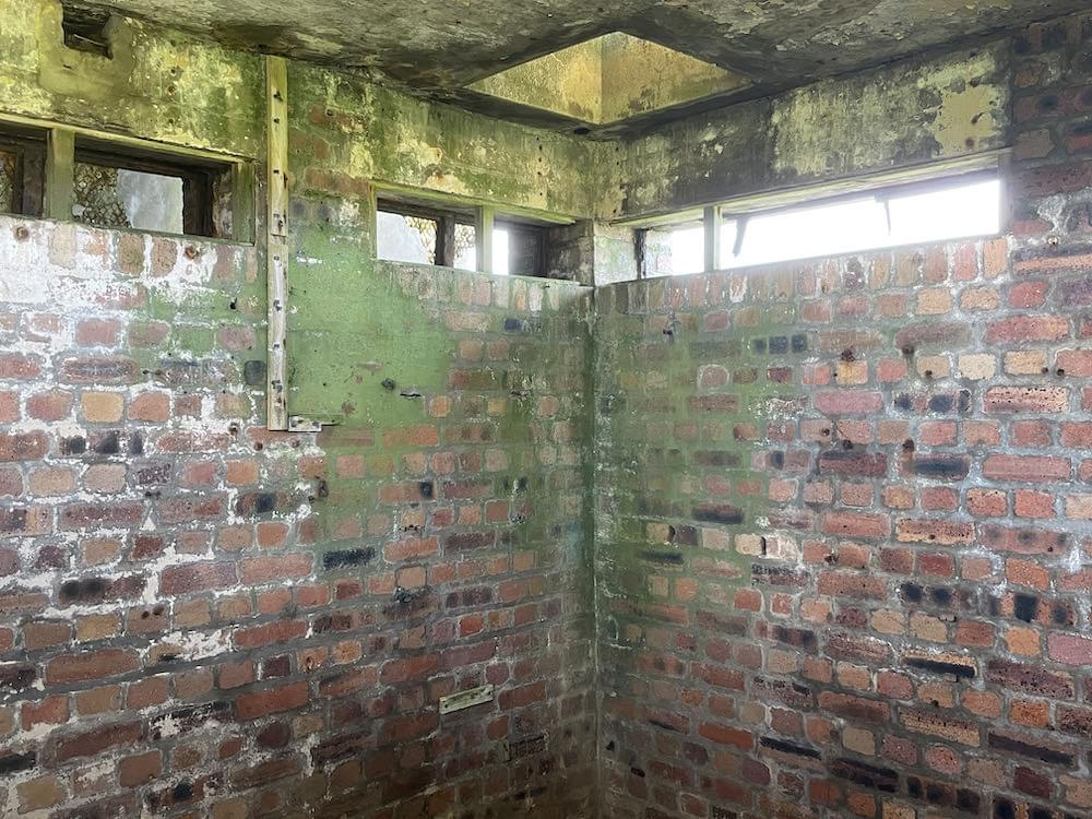 Control tower interior - first floor. Emergency exit hatch from second floor.  (Neil Iosson - 2021)