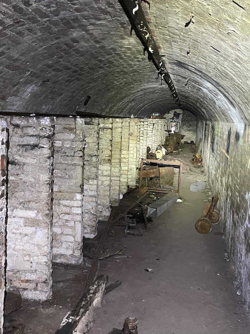 The purpose of these vertical half height walls is unclear. Too many and wrong size/space for toilet walls. (Neil Iosson - 2022)