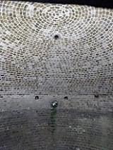 Internal view of Ham House Ice House, showing the fine header brickwork. The holes may be for a floor dating from its use as a WWII air-raid shelter. (Martin Dixon)