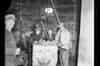 Base of Staple Inn working shaft, empty skip being returned to working face, showing workmen. (1952) (www.digitalarchives.bt.com - TCB 417/E 17667)